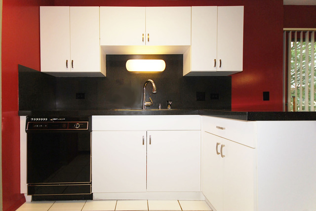 550 Greystone Lane, Unit A2 Wheeling, IL 60090 - Photo 6 of 23 a bathroom with a sink and a mirror