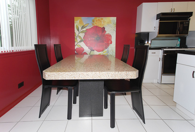 550 Greystone Lane, Unit A2 Wheeling, IL 60090 - Photo 9 of 23 a view of a dining room with furniture
