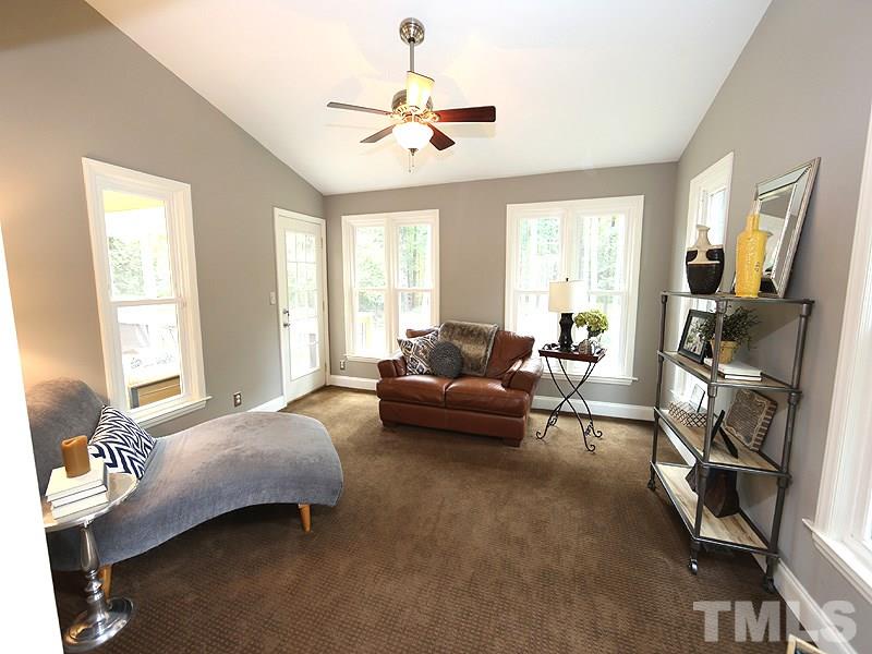 8320 Wheatstone Lane Raleigh, NC 27613 - Photo 11 of 23 Located behind the Living Room, this cozy space overlooks the backyard and the screened porch (off to the left).