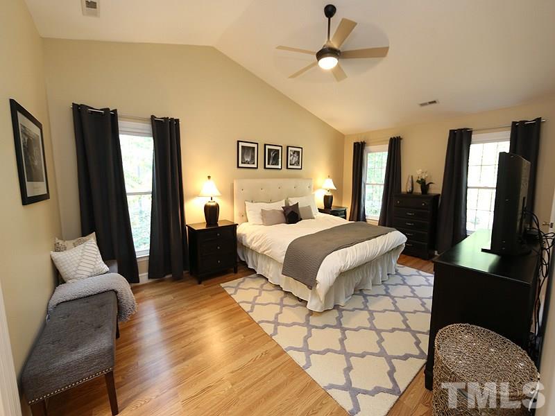 8320 Wheatstone Lane Raleigh, NC 27613 - Photo 13 of 23 No carpet upstairs! Extra large master bedroom with walk in closet featuring Elfa storage system.