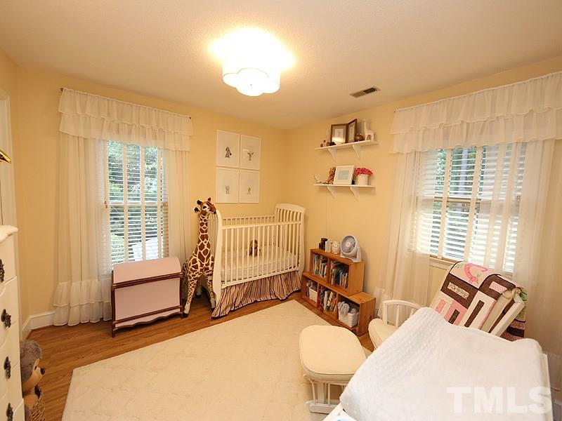 8320 Wheatstone Lane Raleigh, NC 27613 - Photo 15 of 23 Darling bedroom currently set up for a baby's room.
