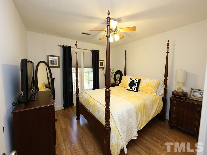 8320 Wheatstone Lane Raleigh, NC 27613 - Photo 16 of 23 Bedroom #3 fits a queen bed and has a deep closet.
