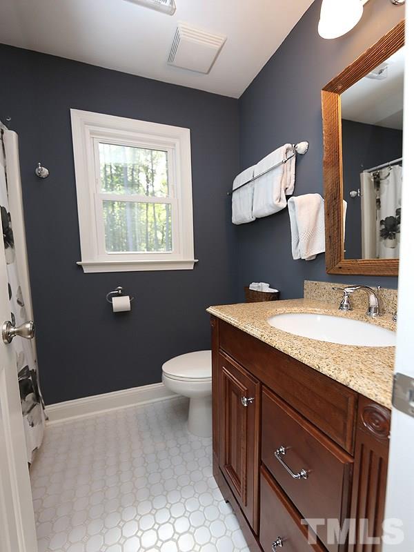 8320 Wheatstone Lane Raleigh, NC 27613 - Photo 17 of 23 Up to date with retro tile floor.