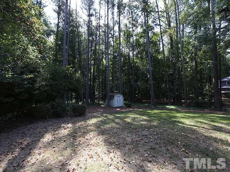 8320 Wheatstone Lane Raleigh, NC 27613 - Photo 21 of 23 Deep back yard extends about 350 feet from the street. Storage shed included.