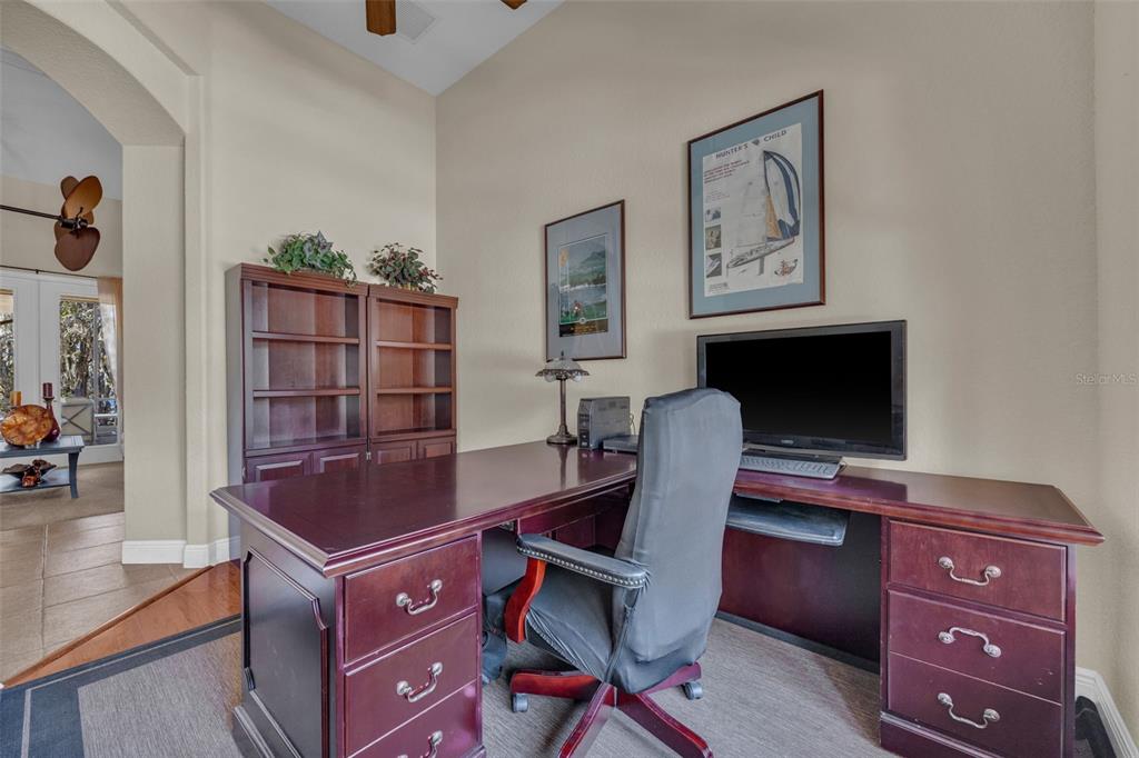 13101 Shadow Run Boulevard Riverview, FL 33569 - Photo 17 of 86 a view of a workspace with furniture and wooden floor