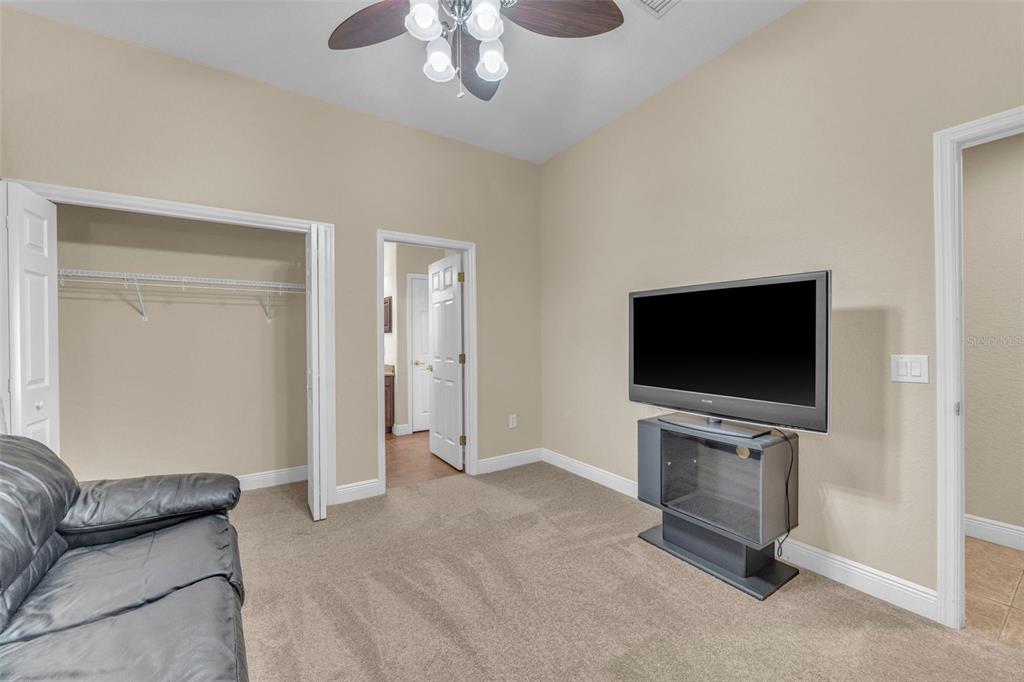 13101 Shadow Run Boulevard Riverview, FL 33569 - Photo 59 of 86 a living room with furniture and a flat screen tv