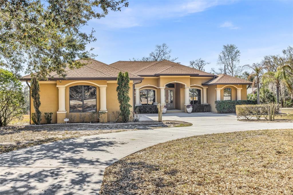 13101 Shadow Run Boulevard Riverview, FL 33569 - Photo 6 of 86 a front view of a house with garden
