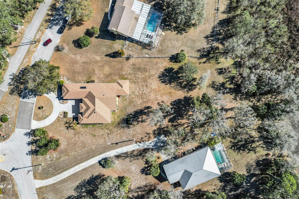 13101 Shadow Run Boulevard Riverview, FL 33569 - Photo 78 of 86 an aerial view of a house with a yard and large trees
