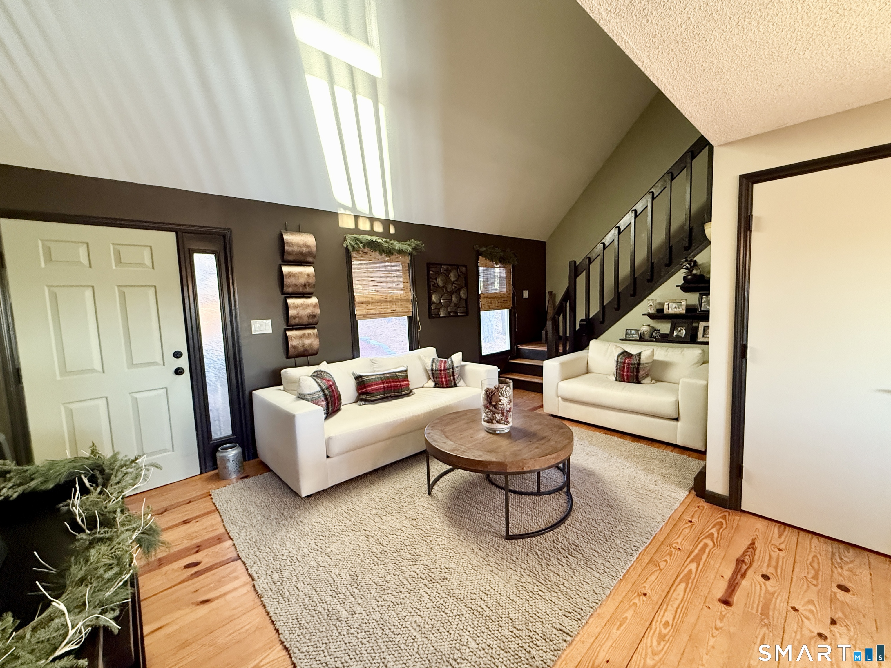 105 Riverside Drive Meriden, CT 06451 - Photo 12 of 27 a living room with furniture and a rug