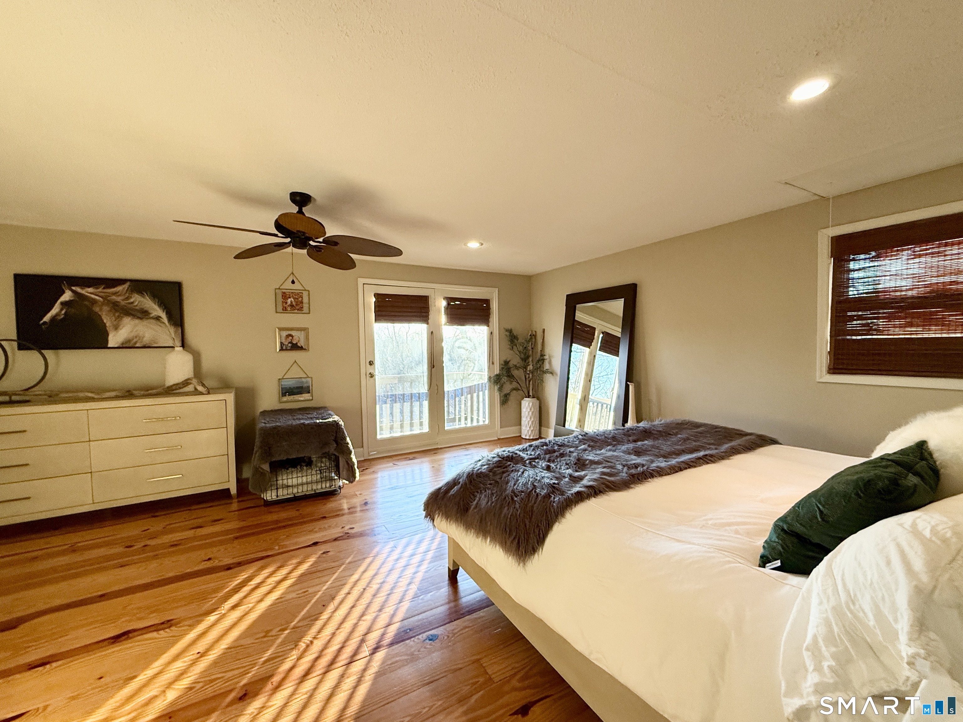 105 Riverside Drive Meriden, CT 06451 - Photo 19 of 27 a bedroom with a bed and a view of kitchen