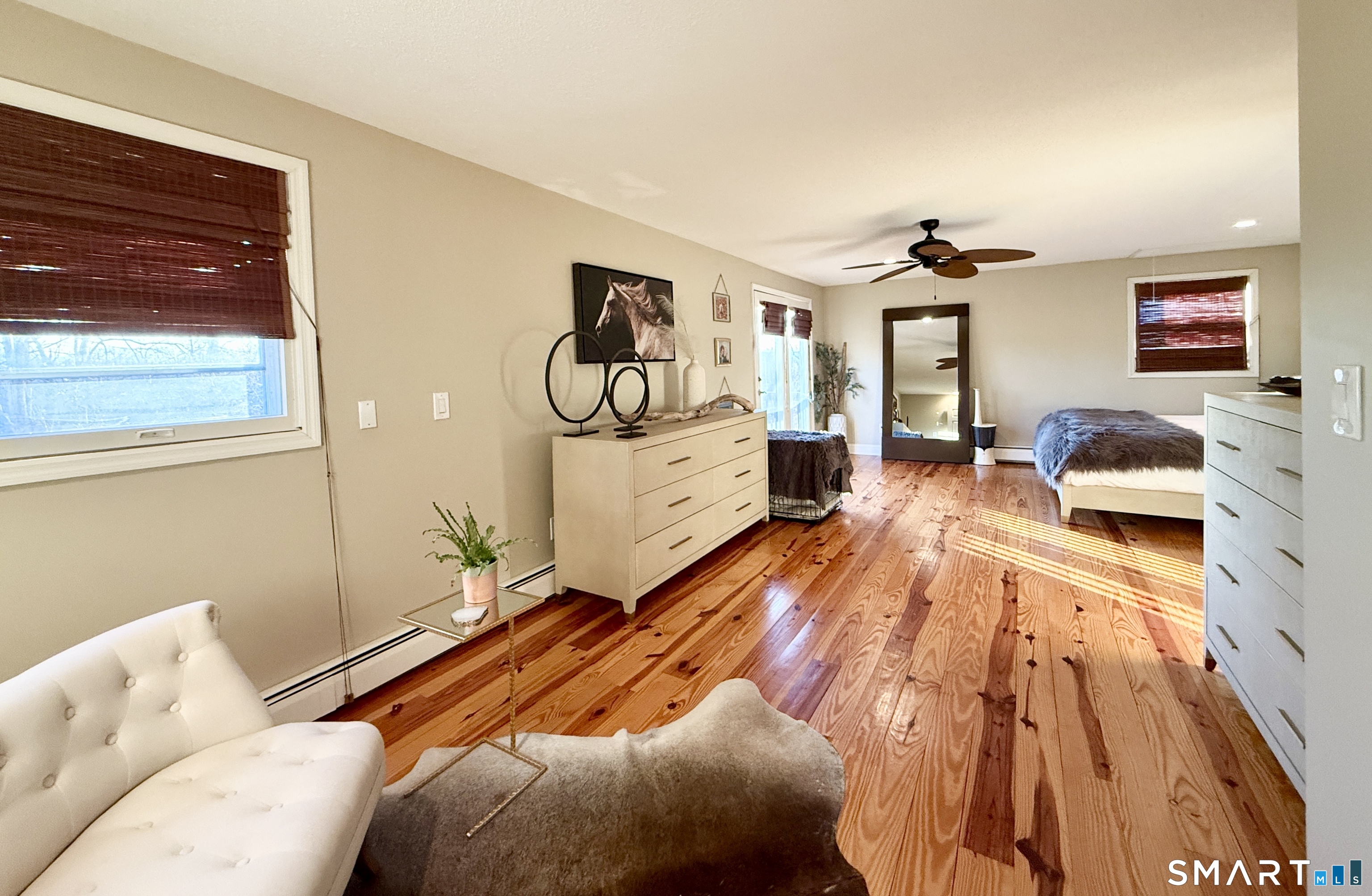 105 Riverside Drive Meriden, CT 06451 - Photo 20 of 27 a bedroom with a bed and wooden floor