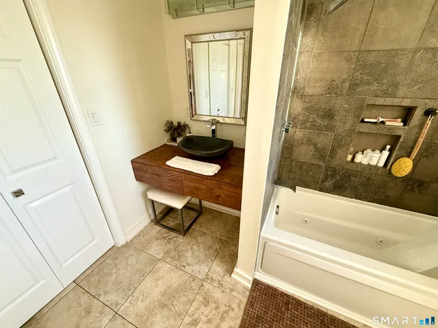 a bathroom with a sink and a bathtub