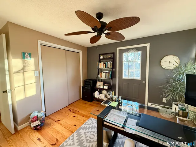 a workspace with furniture and window