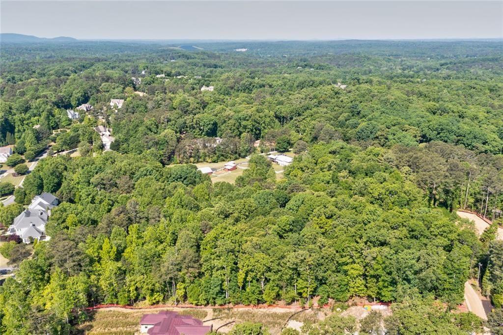 1265 Summit Road Milton, GA 30004 - Photo 10 of 11 a view of a green field with lots of bushes