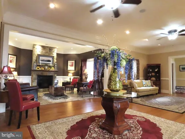 a bathroom with a toilet mirror and vanity