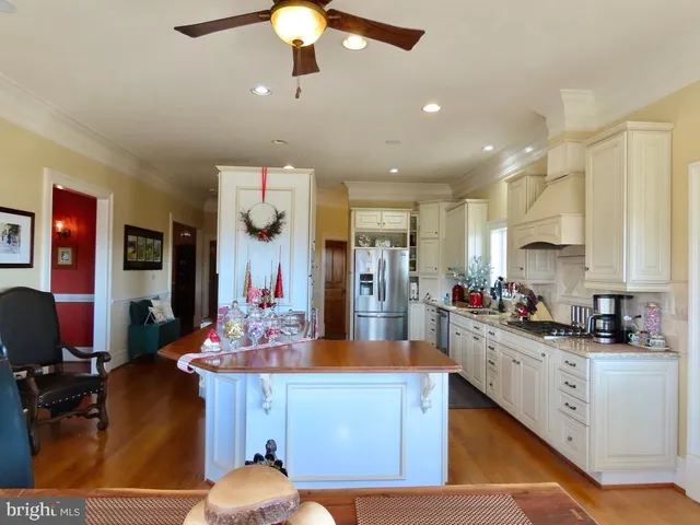 a bathroom with a sink a toilet a mirror and shower curtain