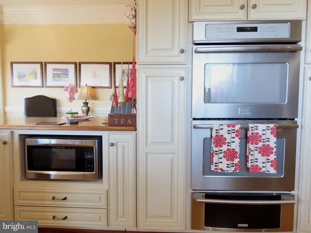 a view of a patio with dining table and chairs