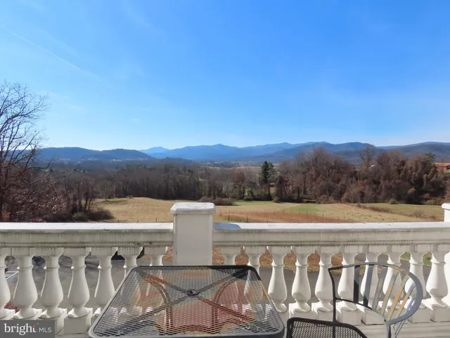 a view of a balcony with chairs