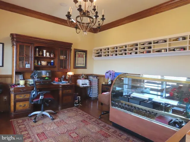 a bedroom with two beds and window