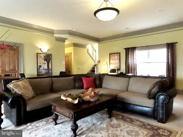 a bedroom with a bed mirror and window