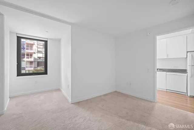 a view of an empty room with a window