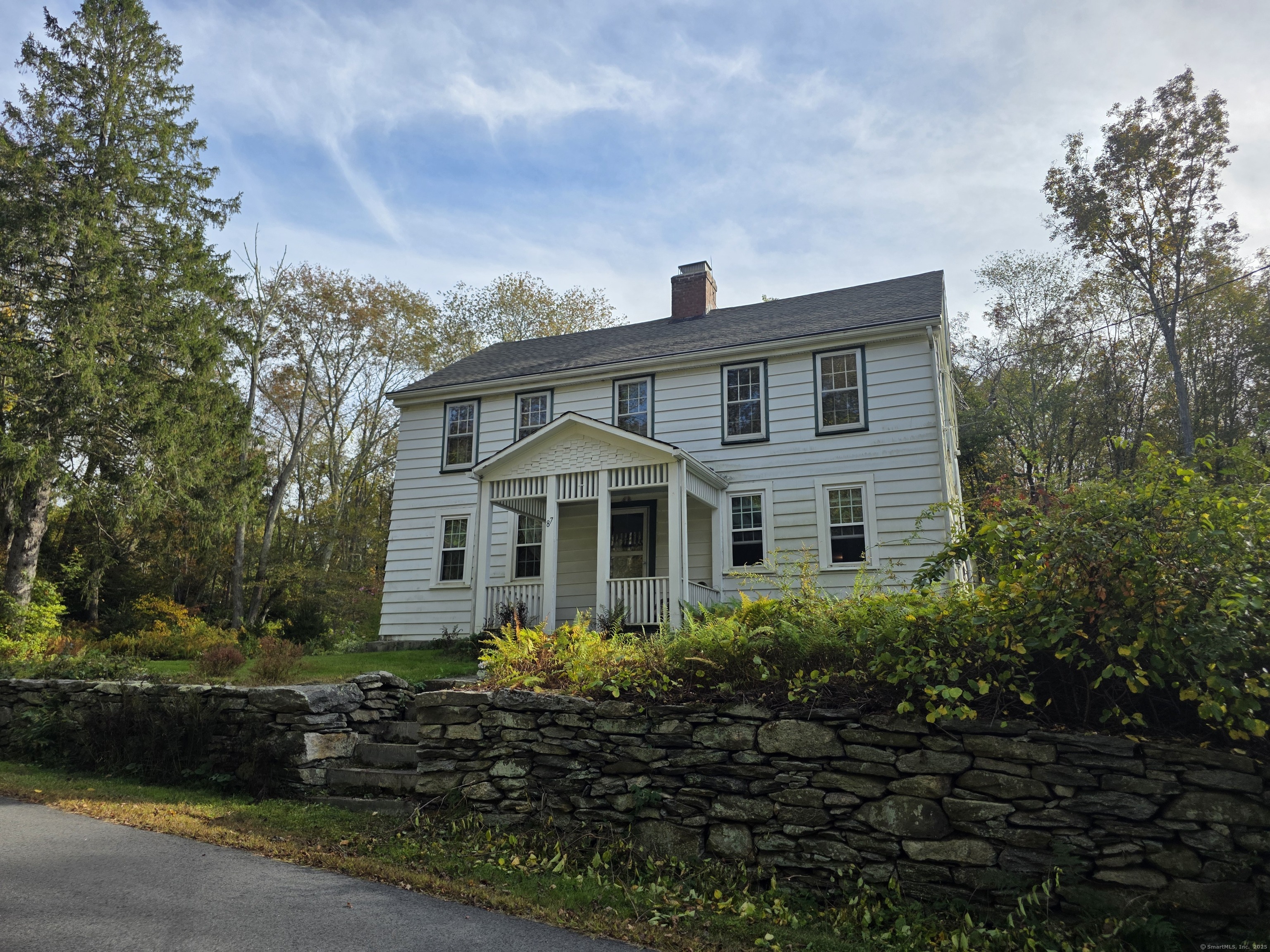 a front view of house with garden