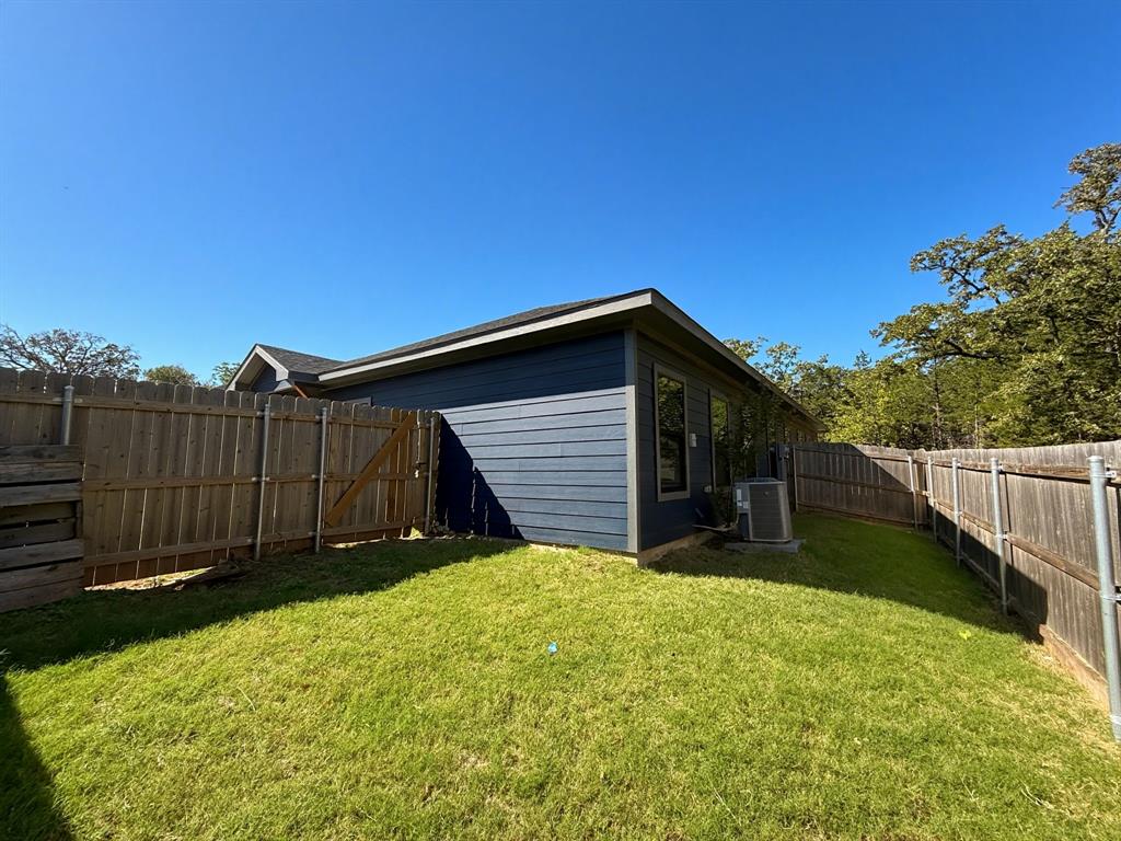 1215 Oak Drive, Unit 105 Denison, TX 75020 - Photo 17 of 17 a view of a backyard