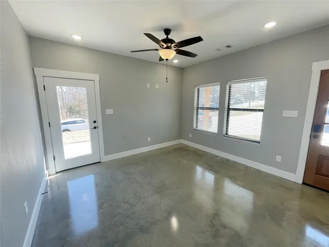 a view of an empty room with a window