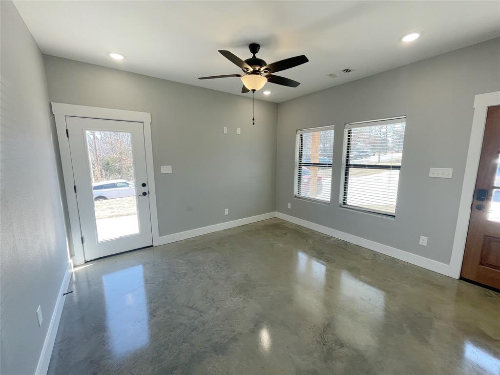 1215 Oak Drive, Unit 105 Denison, TX 75020 - Photo 3 of 17 a view of an empty room with a window