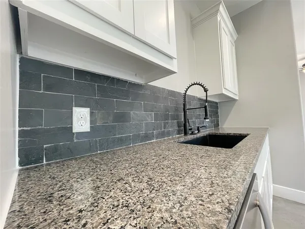 a bathroom with a sink and a shower