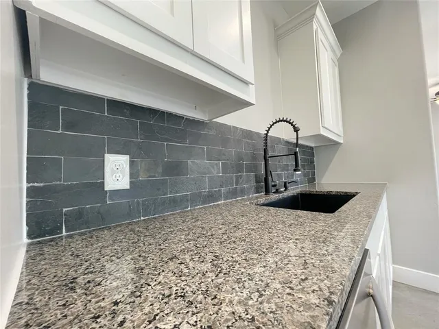 a bathroom with a sink and a shower