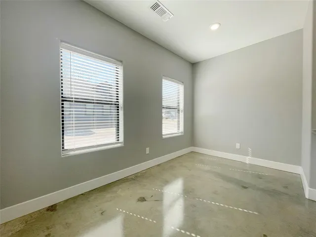 an empty room with windows