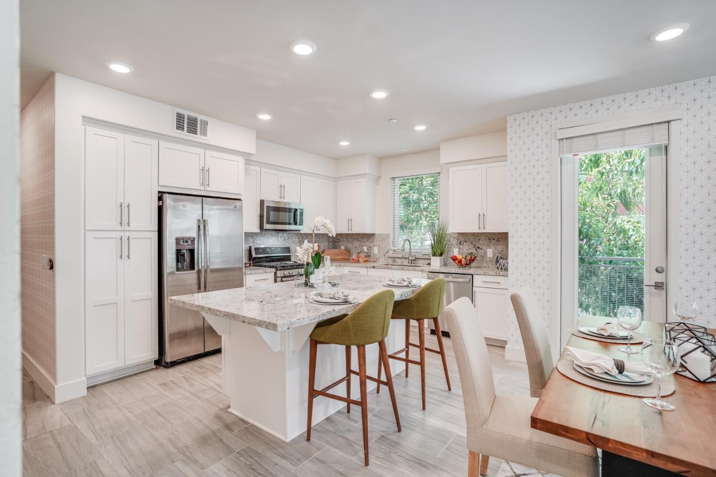 370 Riesling Avenue, Unit 20 Milpitas, CA 95035 - Photo 1 of 36 a kitchen with counter top space a sink appliances and cabinets