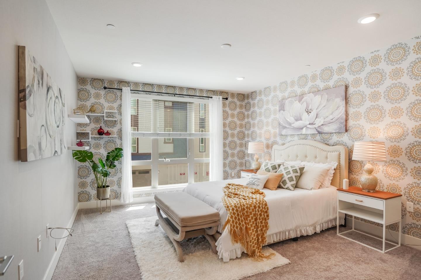 370 Riesling Avenue, Unit 20 Milpitas, CA 95035 - Photo 16 of 36 a bedroom with a bed and a table in it