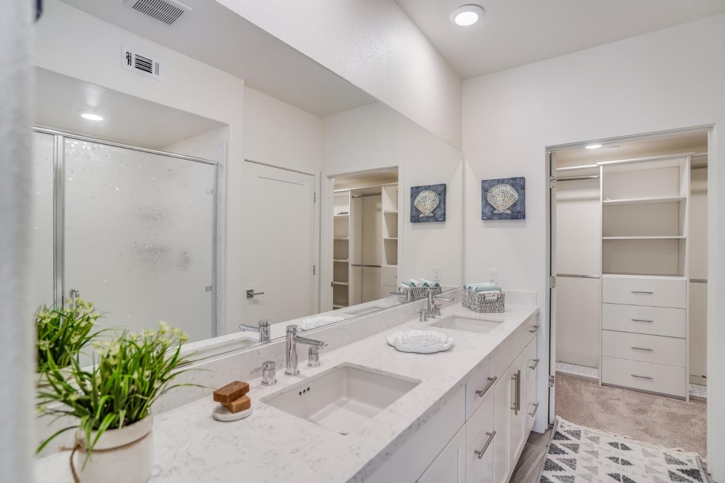 370 Riesling Avenue, Unit 20 Milpitas, CA 95035 - Photo 19 of 36 a bathroom with a sink a vanity and a mirror