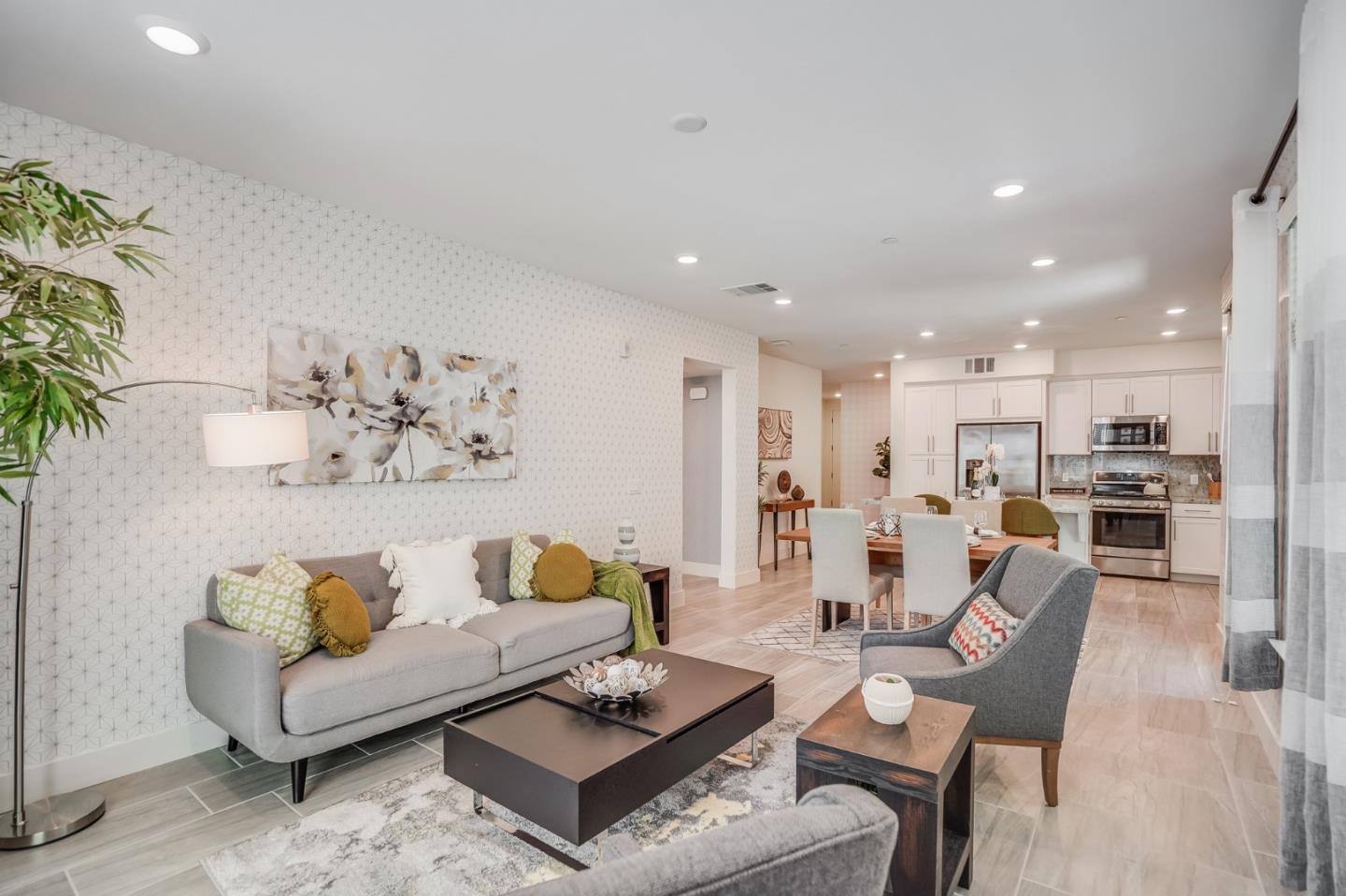 370 Riesling Avenue, Unit 20 Milpitas, CA 95035 - Photo 26 of 36 a living room with furniture kitchen view and a potted plant