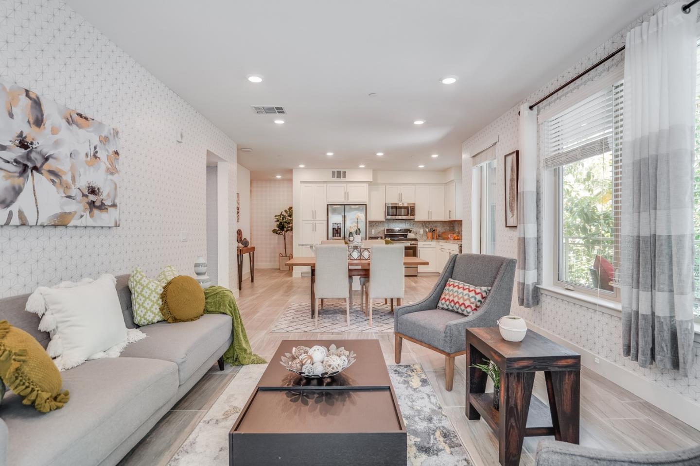370 Riesling Avenue, Unit 20 Milpitas, CA 95035 - Photo 27 of 36 a living room with furniture and a table