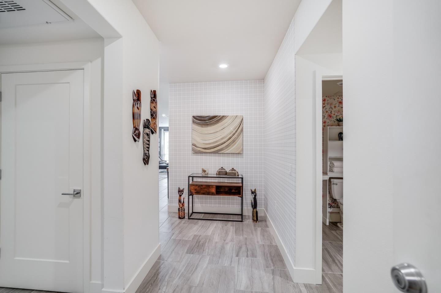 370 Riesling Avenue, Unit 20 Milpitas, CA 95035 - Photo 3 of 36 a bedroom with a bed and a chair