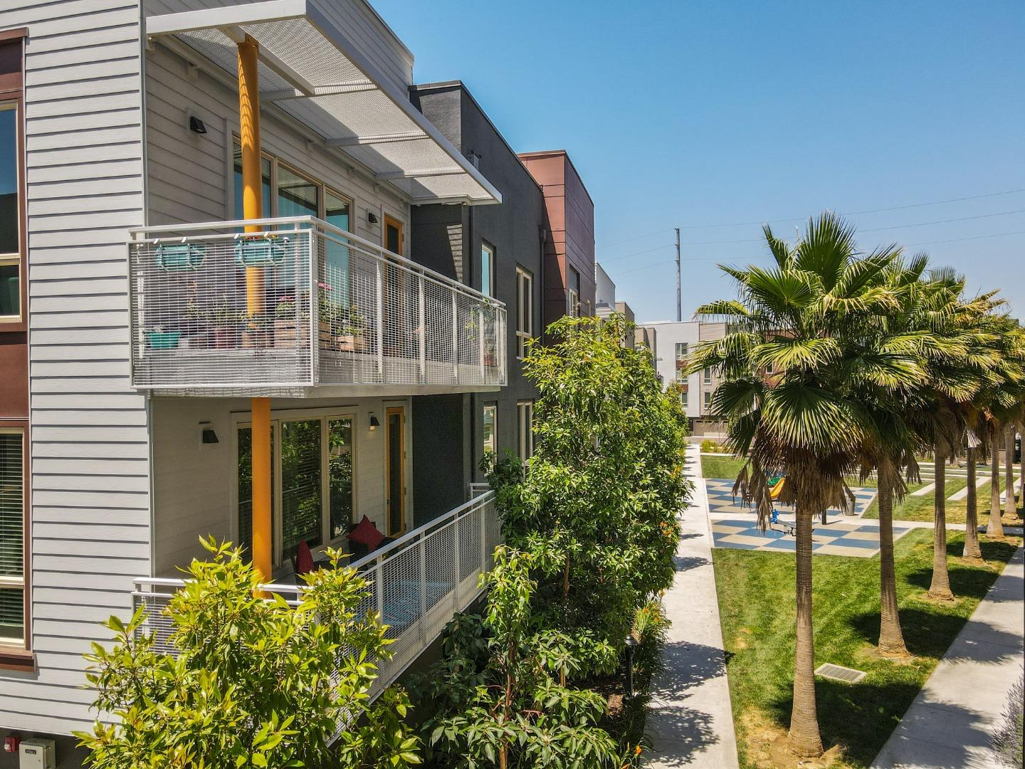 370 Riesling Avenue, Unit 20 Milpitas, CA 95035 - Photo 31 of 36 a view of a house with a plants and a tree