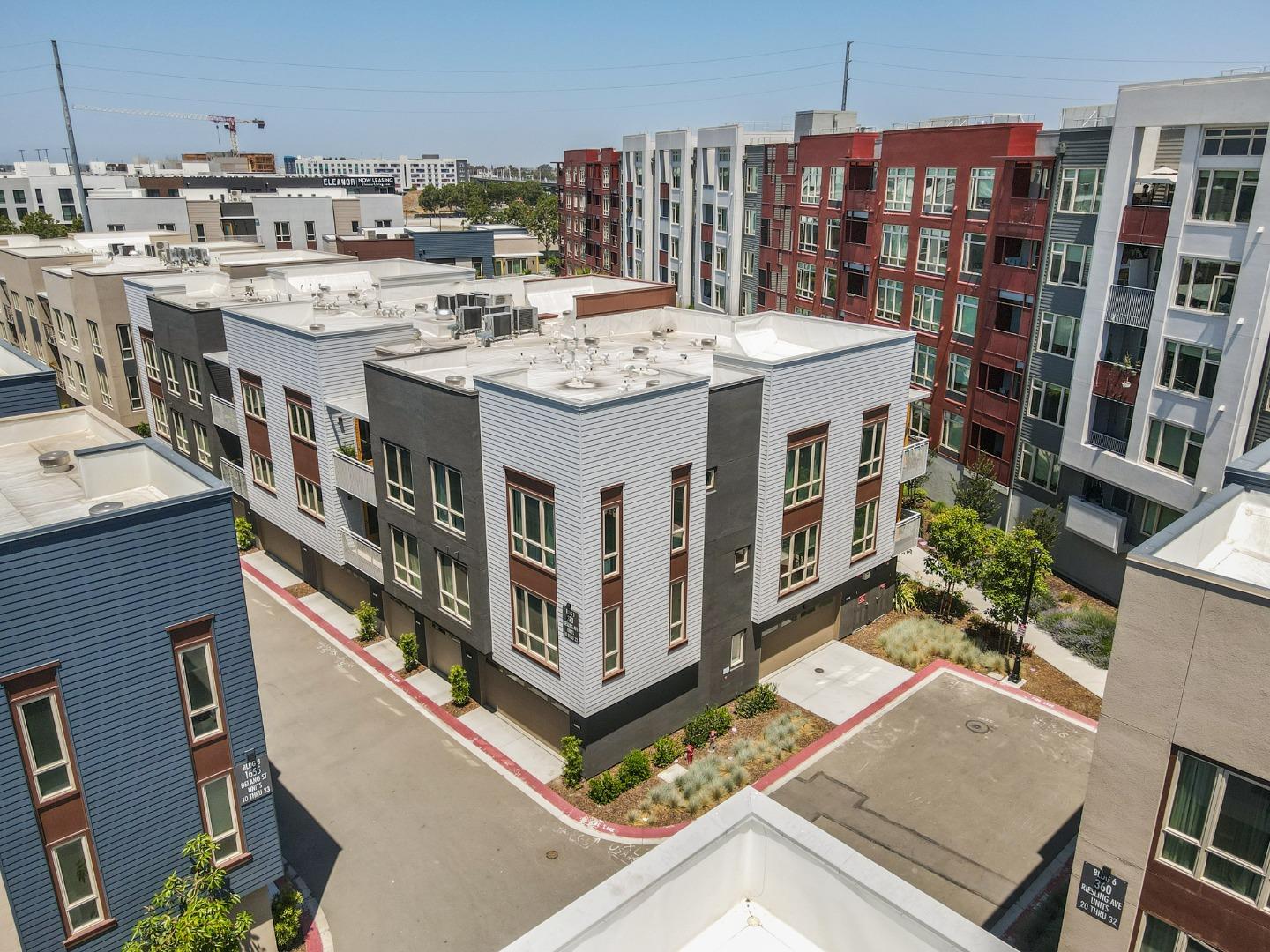 370 Riesling Avenue, Unit 20 Milpitas, CA 95035 - Photo 34 of 36 a view of a building with a lot of buildings