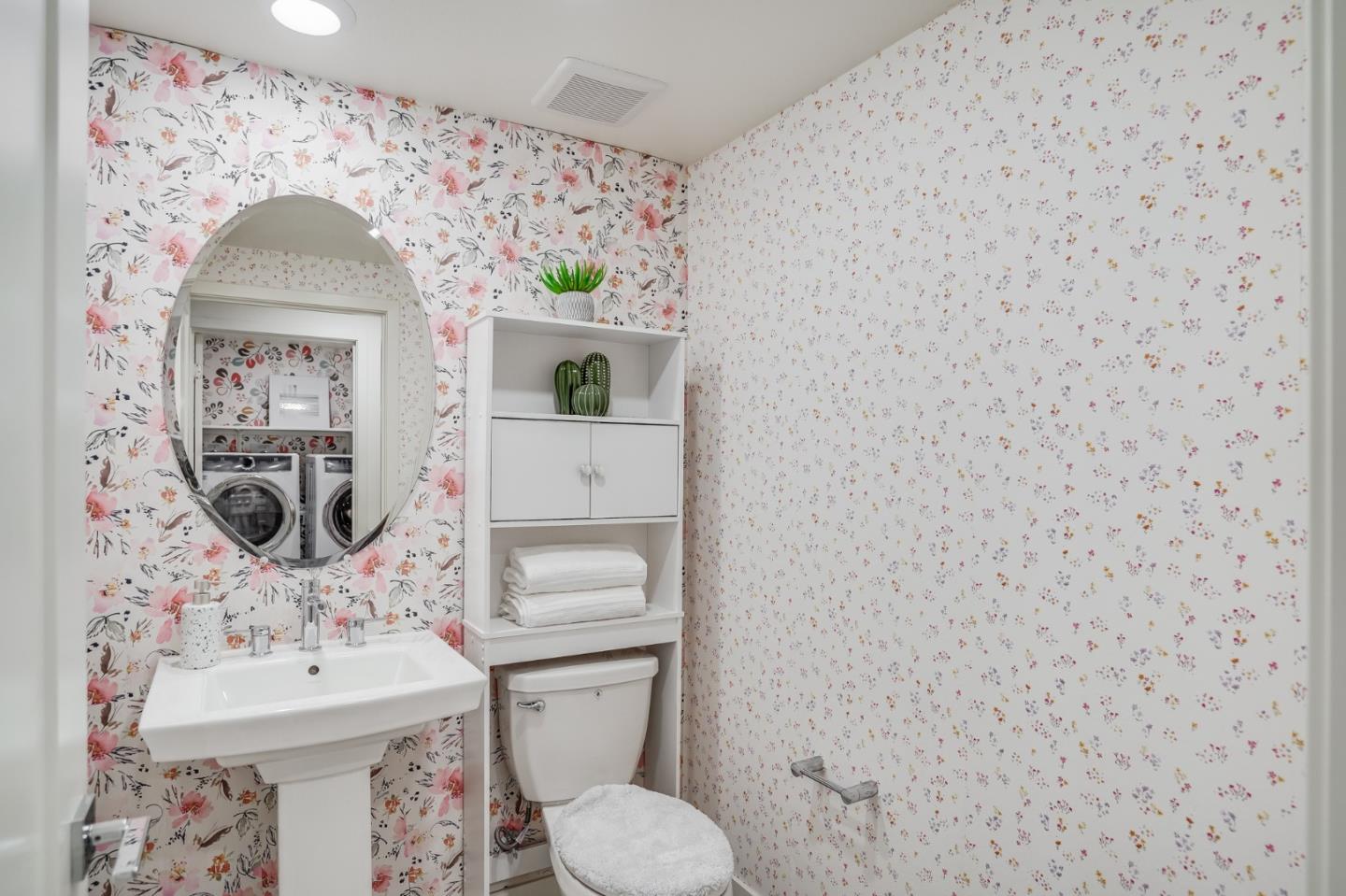 370 Riesling Avenue, Unit 20 Milpitas, CA 95035 - Photo 7 of 36 a bathroom with a toilet sink and mirror