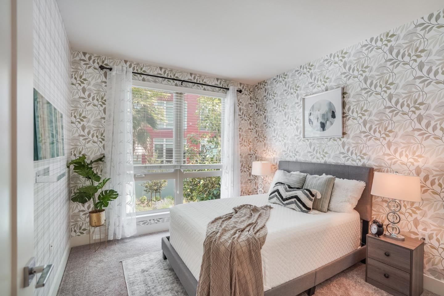 370 Riesling Avenue, Unit 20 Milpitas, CA 95035 - Photo 10 of 36 a bedroom with furniture and a large window