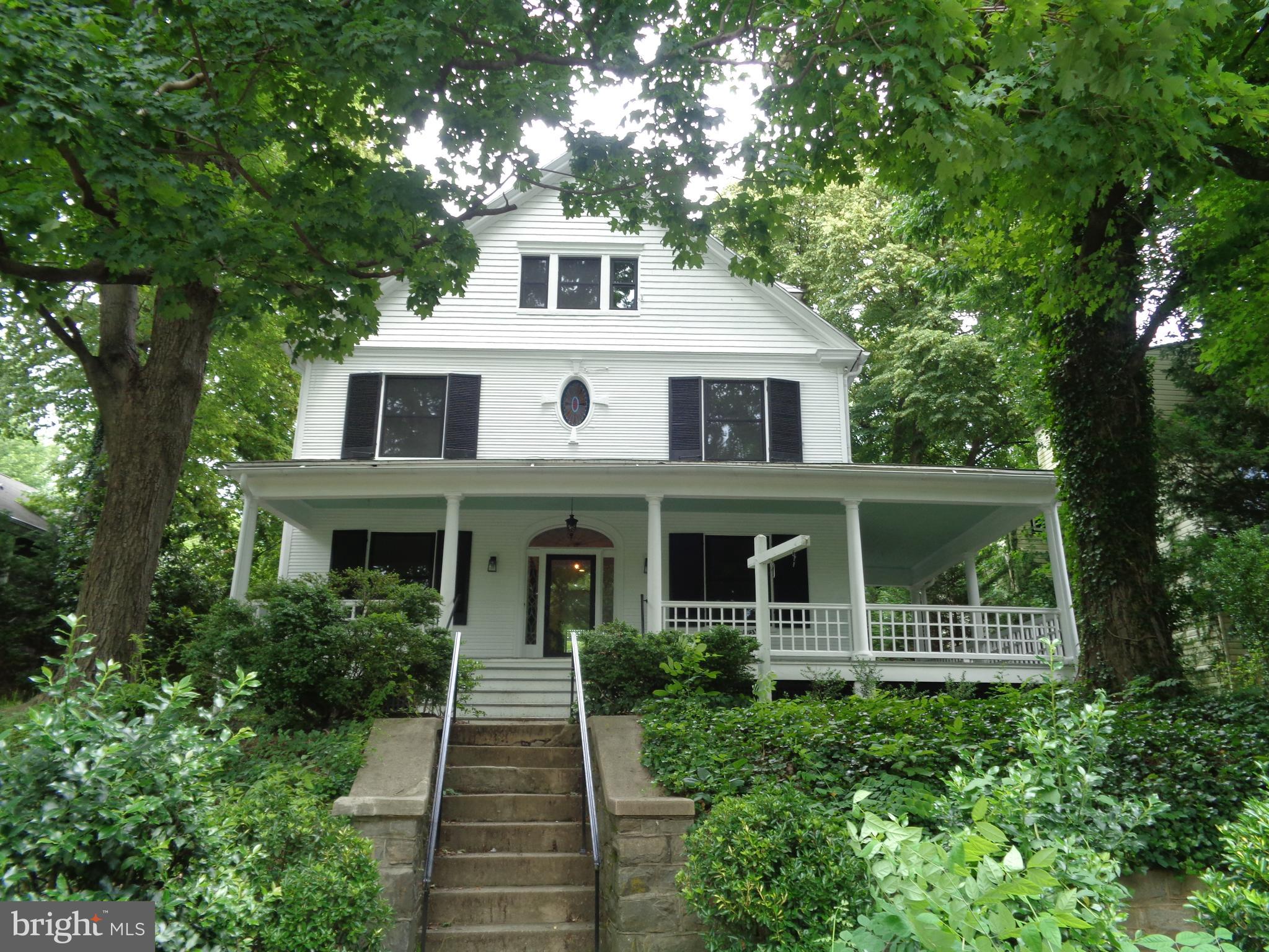 5105 Roland Avenue Baltimore, MD 21210 - Photo 1 of 19 a front view of a house with a yard