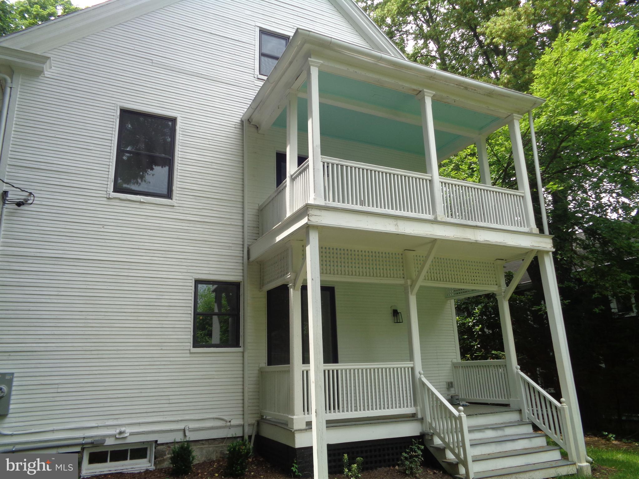 5105 Roland Avenue Baltimore, MD 21210 - Photo 18 of 19 a view of wooden house and a small yard