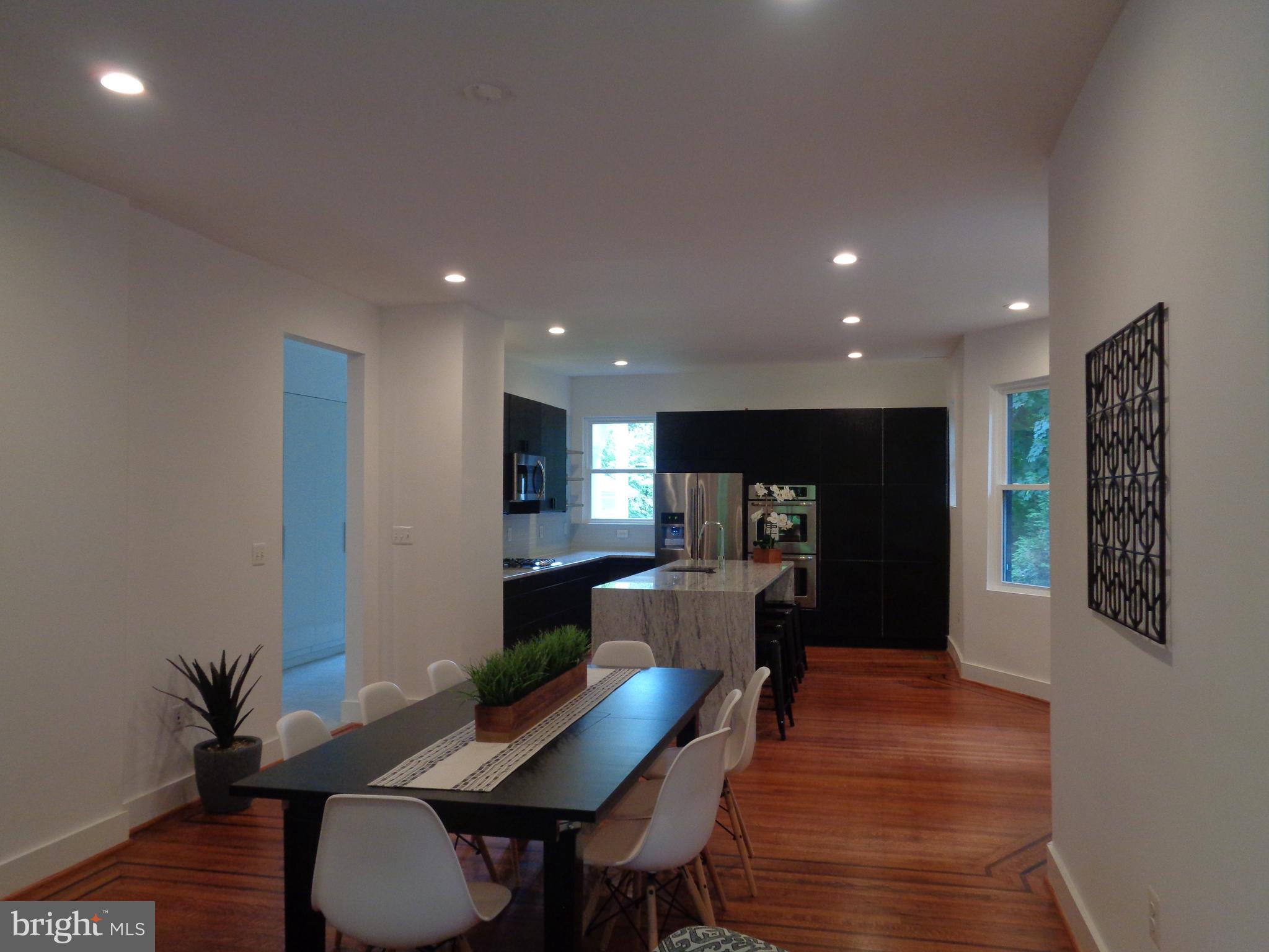 5105 Roland Avenue Baltimore, MD 21210 - Photo 6 of 19 a view of a dining room with furniture