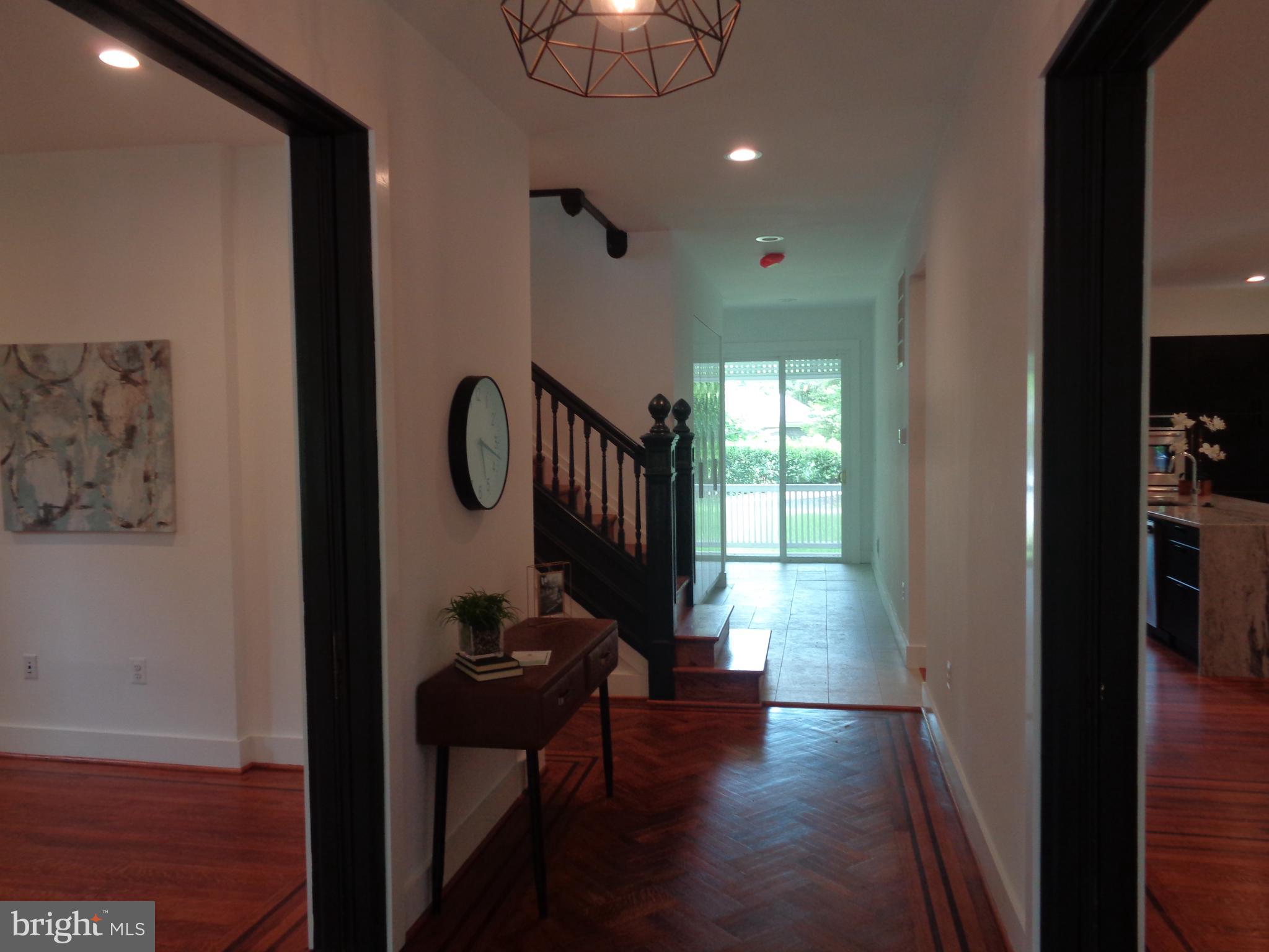 5105 Roland Avenue Baltimore, MD 21210 - Photo 7 of 19 a view of gallery with wooden floor
