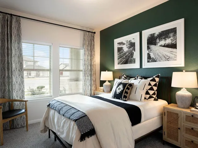 a bedroom with bed and window