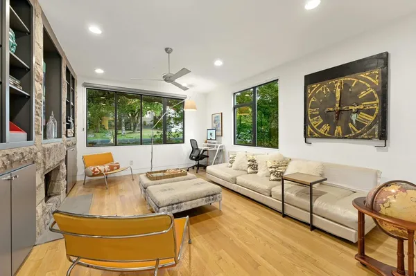 a living room with furniture and a large window
