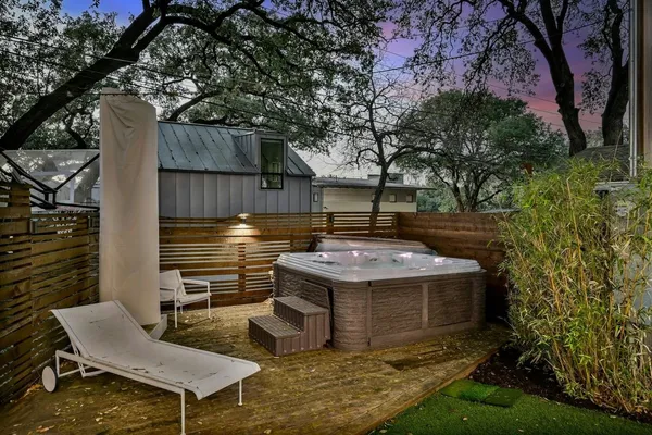 a view of a backyard with plants and a patio