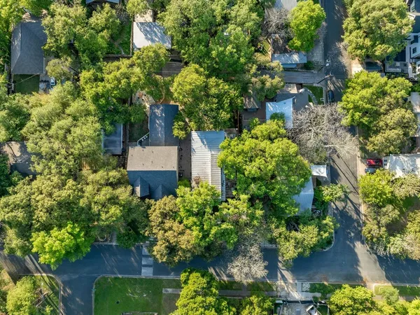 an aerial view of a house with a yard and a garden